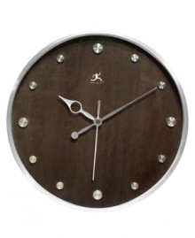 Make time for style with this handsome wall clock. A round wood grain dial with silver hour markers and metal hands adds contemporary flair to any room. Make time for style with this handsome wall clock. A round wood grain dial with silver hour markers and metal hands adds contemporary flair to any room.