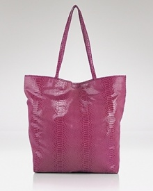 Carlos Falchi's tote is a luxe take on a classic shape. In metallic python embossed leather with an interior pouch, this style strikes an enviable balance between practicality and polish. Carlos Falchi's tote is a luxe take on a classic shape. In metallic python embossed leather with an interior pouch, this style strikes an enviable balance between practicality and polish.