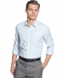 This classic vertical stripe fitted shirt by Calvin Klein should be in every man's closet.