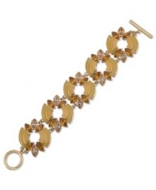 The bold standard. Carolee's flex bracelet is crafted from gold-tone mixed metal with multicolor glass stones adding a vibrant touch. Approximate length: 7-1/2 inches.