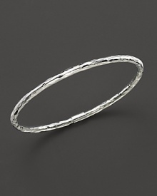 From the Silver collection, a skinny hammered bangle in sterling silver. Designed by Ippolita.