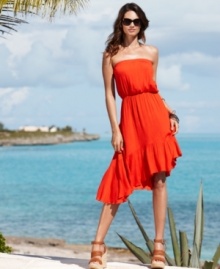 Add a little flirty flair to your beach look with Coco Bianco's ruffled cover-up! The asymmetrical hemline and soft shape make this piece stand out. Add a little flirty flair to your beach look with Coco Bianco's ruffled cover-up! The asymmetrical hemline and soft shape make this piece stand out.