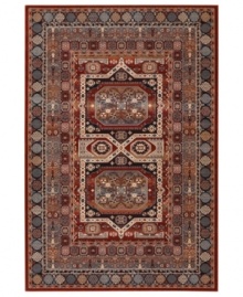 A variety of intricate symmetrical patterns in a bold red and dark blue colorway create a captivating focal point for any space in this area rug from Couristan. Crafted of pure New Zealand wool for long-lasting strength and beauty.