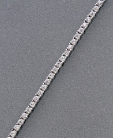 Sweet, shining simplicity. Cubic zirconias (3-3/4 ct. t.w.) set in platinum over sterling silver prongs compose this elegant CRISLU bracelet. Approximate length: 7 inches.