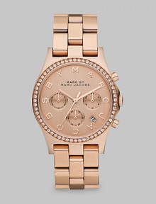 A warm, radiant timepiece with dazzling crystals and a signature dial. Quartz movementWater resistant to 5 ATMRound rose goldtone ion-plated stainless steel case, 40mm (1.6)Crystal bezelRose goldtone chronograph dialLogo markersDate display between 4 and 5 o'clockSecond hand Rose goldtone ion-plated stainless steel link bracelet, 20mm wide (0.8)Imported