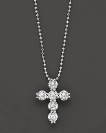 Diamond cross pendant in white gold formed from a gleaming cluster of orbs, with ball chain. Diamond cross pendant in white gold formed from a gleaming cluster of orbs, with ball chain.