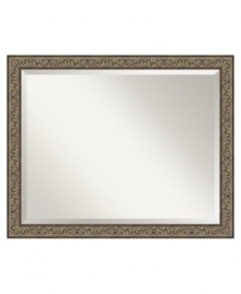 A black-washed golden hue and classic vine motif make this wall mirror at home in refined country decor. The narrow bronze frame and beveled mirror edge put the focus on your reflection and accent the bedroom, dining room or foyer with a distinctly feminine grace. A black-washed golden hue and classic vine motif make this wall mirror at home in refined country decor. The narrow bronze frame and beveled mirror edge put the focus on your reflection and accent the bedroom, dining room or foyer with a distinctly feminine grace.
