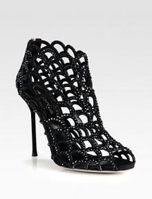 A suede heel lifts this modern cage silhouette of fine satin coated in light-catching Swarovski crystals. Suede-covered heel, 4¼ (110mm)Satin upper with Swarovski crystalsPeep toeBack zipLeather lining and solePadded insoleMade in Italy