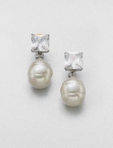 A simple and elegant design featuring a lustrous pearl accented with a brilliant crystal. 14mm round white organic man-made pearlCrystalsSterling silverSize, about 2Post clip backImported A simple and elegant design featuring a lustrous pearl accented with a brilliant crystal. 14mm round white organic man-made pearlCrystalsSterling silverSize, about 2Post clip backImported