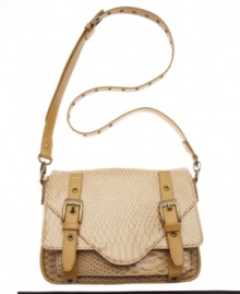 Slither up to great style with this embossed snakeskin print crossbody from KDNY by Kelsi Dagger. Antique brass hardware and bold front buckles add eye-catching appeal to this unique design. Slither up to great style with this embossed snakeskin print crossbody from KDNY by Kelsi Dagger. Antique brass hardware and bold front buckles add eye-catching appeal to this unique design.