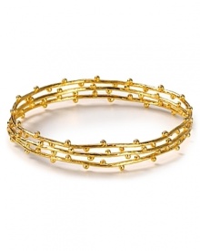 Stackable bangles from Gorjana in 18-karat gold vermeil are a delicate touch - now imagine how they stand out featuring delicate dot details.