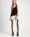 Shift into high-fashion gear with these leggings-style skinnies, defined by contrasting side panels that evoke a sporty vibe. THE FITRise, about 8Inseam, about 30THE DETAILSZip flyFive-pocket styleBody: Cotton/polyurethaneTrim: LeatherMachine washMade in USA of imported fabricModel shown is 5'11 (178cm) wearing US size 4.