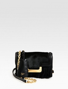 A textured blend of haircalf, faux mink and leather accented with radiant hardware.Chain and leather shoulder strap, 23¼ dropMagnetic snap flap closureOne outside open pocketOne inside zip pocketFully lined7¼W X 5H X 2¼DImported A textured blend of haircalf, faux mink and leather accented with radiant hardware.Chain and leather shoulder strap, 23¼ dropMagnetic snap flap closureOne outside open pocketOne inside zip pocketFully lined7¼W X 5H X 2¼DImported