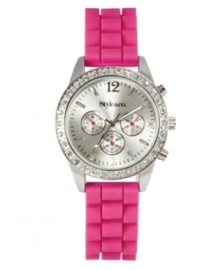 Become tickled pink with this bright watch by Style&co. Pink silicone strap and round silver tone mixed metal case. Bezel embellished with crystal accents. Brushed silver tone dial features numeral at twelve o'clock, stick indices, three multifunctional subdials, three luminous hands, logo and pink accents. Quartz movement. Two-year limited warranty.