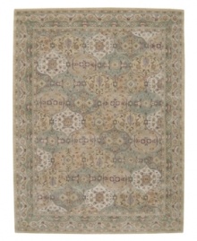 Imported from India, this magnificent rug presents a courtly style fit for today's most fashionable homes. Varying shades of green and beige are patterned in distinctive traditional design. Hand-tufted from ultra-soft 100% wool pile. Imported from India, this magnificent rug presents a courtly style fit for today's most fashionable homes. Varying shades of green and beige are patterned in distinctive traditional design. Hand-tufted from ultra-soft 100% wool pile.