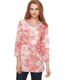 An allover paisley print creates a colorful impact on this tunic from J Jones New York. Rhinestones at the neckline add a little sparkle, too!