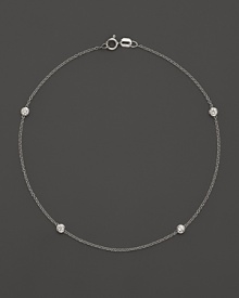 Diamond bezels sparkle from the stations on this dainty 14K white gold ankle bracelet. Diamond bezels sparkle from the stations on this dainty 14K white gold ankle bracelet.
