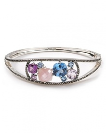 A striking bangle is just the thing to enliven your wardrobe. This simple silver style from Judith Jack features multi colored stones and a shapely design.