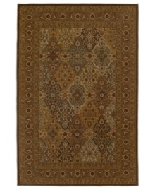 A traditional panel design is woven of supreme New Zealand wool in the Ellsworth area rug in antique tones of mocha, brown, celadon and beige for a truly rich addition to old-world interiors. Made in the USA.