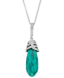 This feminine pendant features a dangling, drop-shaped emerald Swarovski crystal in an exclusive cut. Elaborate details in clear crystal pavé add a regal note to this precious design. The pendant comes on a rhodium-plated chain and is perfect for cocktail parties. Approximate length: 15-7/10 inches + 2-inch extender. Approximate drop: 1/2 inch.