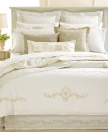 Relax in ultimate comfort with this Trousseau Crest comforter from Martha Stewart Collection, featuring tan accents on a clean background in luxurious 300-thread count Egyptian cotton. Relax in ultimate comfort with this Trousseau Crest comforter from Martha Stewart Collection, featuring tan accents on a clean background in luxurious 300-thread count Egyptian cotton.
