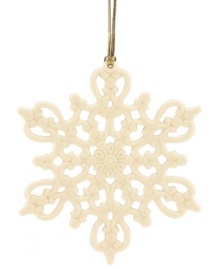 Turn a white Christmas fantasy into reality with this classic snowflake ornament from Lenox. Intricate pierced detail and an elegant ivory glaze help you and your family create your very own winter wonderland.