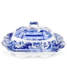 With a quaint country scene and the Imari Oriental border of Spode's Blue Italian dinnerware, this covered vegetable dish lends distinct old-world charm to traditional tables. With a quaint country scene and the Imari Oriental border of Spode's Blue Italian dinnerware, this covered vegetable dish lends distinct old-world charm to traditional tables.
