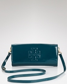 For night, Tory Burch dresses up it's clutch in glossy patent leather. Ideally sized to tuck inside a tote and take to dinner. it's a slick way to take your style out for the evening. For night, Tory Burch dresses up it's clutch in glossy patent leather. Ideally sized to tuck inside a tote and take to dinner. it's a slick way to take your style out for the evening.
