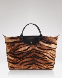 In a wild tiger print, Longchamp's cotton handbag channels safari-chic. In a wild tiger print, Longchamp's cotton handbag channels safari-chic.