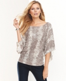 Channel your wild side in INC's snakeskin-print petite top, complete with shining sequins. In a dolman-sleeve silhouette and neutral palette, it makes just the right impact.