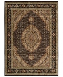 Distinctive flair with roots in Persian design. This exquisitely ornate area rug is abound in deep, striking black and beige tones, highlighted by a dramatic central medallion, and crafted from Nourison's own Opulon(tm) yarns for a densely woven pile with long-lasting color retention and durability.