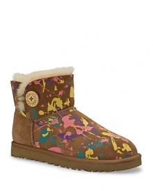 Channel your inner Jackson Pollock à la UGG® Australia with the Mini Bailey Button boot in a playful paint splatter print. Channel your inner Jackson Pollock à la UGG® Australia with the Mini Bailey Button boot in a playful paint splatter print.