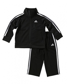 A warm up set rendered with Adidas' signature quality and style, the zip mockneck jacket and matching pants, each crafted in breathable tricot for high-performance comfort. A warm up set rendered with Adidas' signature quality and style, the zip mockneck jacket and matching pants, each crafted in breathable tricot for high-performance comfort.