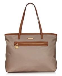 MICHAEL Michael Kors gives a timeless silhouette a luxe upgrade with 18K gold signature hardware and rich leather trim. Crafted in durable nylon with a soft sheen finish, this carryall is pure perfection. MICHAEL Michael Kors gives a timeless silhouette a luxe upgrade with 18K gold signature hardware and rich leather trim. Crafted in durable nylon with a soft sheen finish, this carryall is pure perfection.