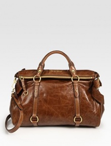 Gorgeous vitello calfskin carryall with bow detail at the sides.Double top handles, 4¼ dropDetachable shoulder strap, 19 dropTop zip closureMetal logo detailProtective metal feetOne inside zip pocketOne inside open pocketCotton/satin lining14½W X 10H X 7DMade in Italy