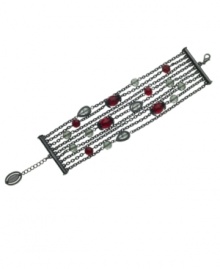 Understated and unique. Subtly adorned with black and faceted red crystals, T Tahari's Crystal Elegance Collection nine-row bracelet is crafted in hematite tone mixed metal. Nickel free for sensitive skin. Approximate length: 7-1/4 inches + 1-inch extender. Understated and unique. Subtly adorned with black and faceted red crystals, T Tahari's Crystal Elegance Collection nine-row bracelet is crafted in hematite tone mixed metal. Nickel free for sensitive skin. Approximate length: 7-1/4 inches + 1-inch extender.