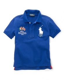 A preppy short-sleeved polo shirt in breathable cotton mesh is accented with country embroidery, celebrating Team USA's participation in the 2012 Olympics. A preppy short-sleeved polo shirt in breathable cotton mesh is accented with country embroidery, celebrating Team USA's participation in the 2012 Olympics.