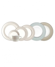 Taking cues from her renowned bridal gowns, designer Monique Lhuillier presents the fresh, fanciful and delicately detailed Etoile Platinum place settings. In sparkling pearlescent china, each border in the collection of dinnerware and dishes features three rows of glossy raised dots and a fine stitch-like pattern. In a sophisticated, neutral linen hue.