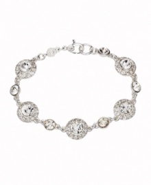 A little sparkle takes your look a long way. Monet bracelet features round-cut cubic ziconias surrounded by halos of cubic zirconia accents. Crafted in silver tone mixed metal. Approximate length: 7-1/2 inches. A little sparkle takes your look a long way. Monet bracelet features round-cut cubic ziconias surrounded by halos of cubic zirconia accents. Crafted in silver tone mixed metal. Approximate length: 7-1/2 inches.