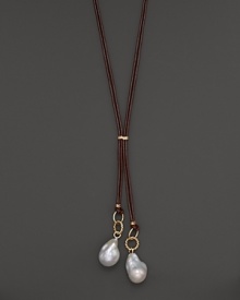 Boldly gleaming baroque freshwater pearls add rich luster to 14K yellow gold and leather. By Nancy B. Boldly gleaming baroque freshwater pearls add rich luster to 14K yellow gold and leather. By Nancy B.