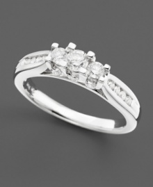 Three round-cut diamonds and channel-set diamonds along the shank combine for show-stopping sparkle (1/2 ct. t.w.). Diamond ring set in 14k white gold. Three round-cut diamonds and channel-set diamonds along the shank combine for show-stopping sparkle (1/2 ct. t.w.). Diamond ring set in 14k white gold.