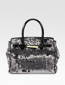 Channel old-Hollywood glamour in this sequined silk carryall finished with patent leather trim.Double top handles, 5¼ dropMagnetic top closureProtective metal feetOne inside zip pocketOne inside leather open pocketSatin lining11W X 13¼H X 6DImported Channel old-Hollywood glamour in this sequined silk carryall finished with patent leather trim.Double top handles, 5¼ dropMagnetic top closureProtective metal feetOne inside zip pocketOne inside leather open pocketSatin lining11W X 13¼H X 6DImported