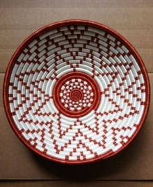 For a bright future. Like the red-hot sun of Rwandan summers, this handcrafted basket lends new brilliance to any setting. Cherish it and the message of hope it sends to its maker by displaying it prominently on a wall or table. For a bright future. Like the red-hot sun of Rwandan summers, this handcrafted basket lends new brilliance to any setting. Cherish it and the message of hope it sends to its maker by displaying it prominently on a wall or table.