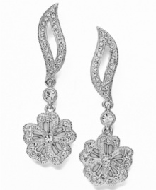 Up the elegance factor. Eliot Danori's Plumeria earrings feature a wistfully graceful design that frames your face. Crafted in silver tone mixed metal with sparkling crystals and an intricate floral shape. Approximate drop: 1-1/2 inches.