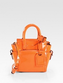 A versatile top-handle satchel offering stunning glamour, thanks to its patent-leather fabrication.Detachable adjustable top handle, 4 dropDetachable adjustable shoulder strap, 21-22½ drop Top zip closureThree outside open pocketsOne outside detachable pouchOne inside zip pocketTwo inside open pocketsCotton liningFully lined10½W X 9H X 4DImported A versatile top-handle satchel offering stunning glamour, thanks to its patent-leather fabrication.Detachable adjustable top handle, 4 dropDetachable adjustable shoulder strap, 21-22½ drop Top zip closureThree outside open pocketsOne outside detachable pouchOne inside zip pocketTwo inside open pocketsCotton liningFully lined10½W X 9H X 4DImported