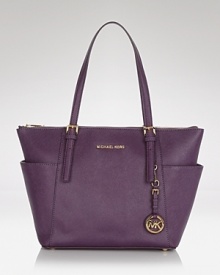 MICHAEL Michael Kors' signature Jet Set tote arrives in saffiano-finished leather with room for the daily essentials. It's so ready for takeoff. MICHAEL Michael Kors' signature Jet Set tote arrives in saffiano-finished leather with room for the daily essentials. It's so ready for takeoff.