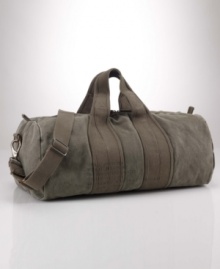 A heavy-duty, barrel-style canvas duffle is the perfect go-anywhere bag with its ability to stand up to the elements and maintain vintage style. A heavy-duty, barrel-style canvas duffle is the perfect go-anywhere bag with its ability to stand up to the elements and maintain vintage style.