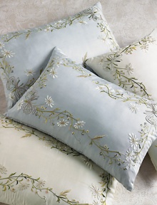 Dainty, hand-embroidered meadow flowers adorn this lovely pillow's framework in the palest potpourri of tints. 14 X 22Silk sateen with feather/down fillDry cleanImported