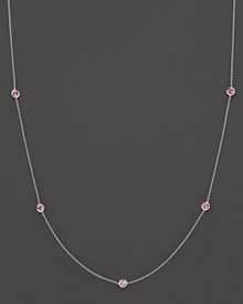 Sapphire stations with Roberto Coin's signature ruby accents add a touch of drama to this gorgeous gold necklace.