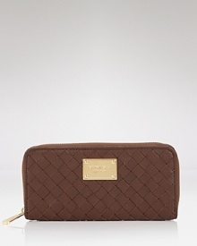 MICHAEL Michael Kors' wallet is a covet-worthy way to organize your daytime essentials. This piece features rich leather for tactile luxury, punctuated by the brand's signature hardware. MICHAEL Michael Kors' wallet is a covet-worthy way to organize your daytime essentials. This piece features rich leather for tactile luxury, punctuated by the brand's signature hardware.